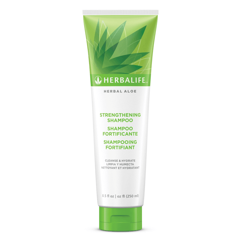 Herbal Aloe Strengthening Shampoo in a tube with green design, promotes clean and hydrated hair.